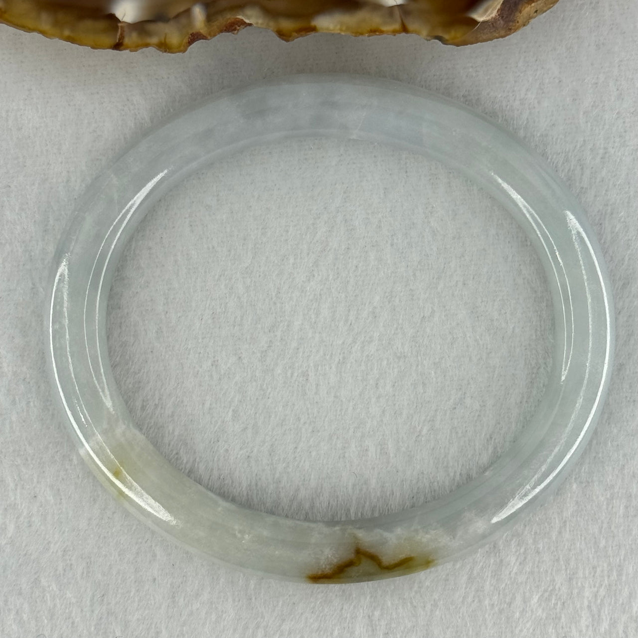 Type A Sky Blue with Green and Brown Patch Jadeite Oval Bangle Internal Diameter 58.0mm 32.09g 7.4 by 7.9mm (External Rough with Internal Lines)