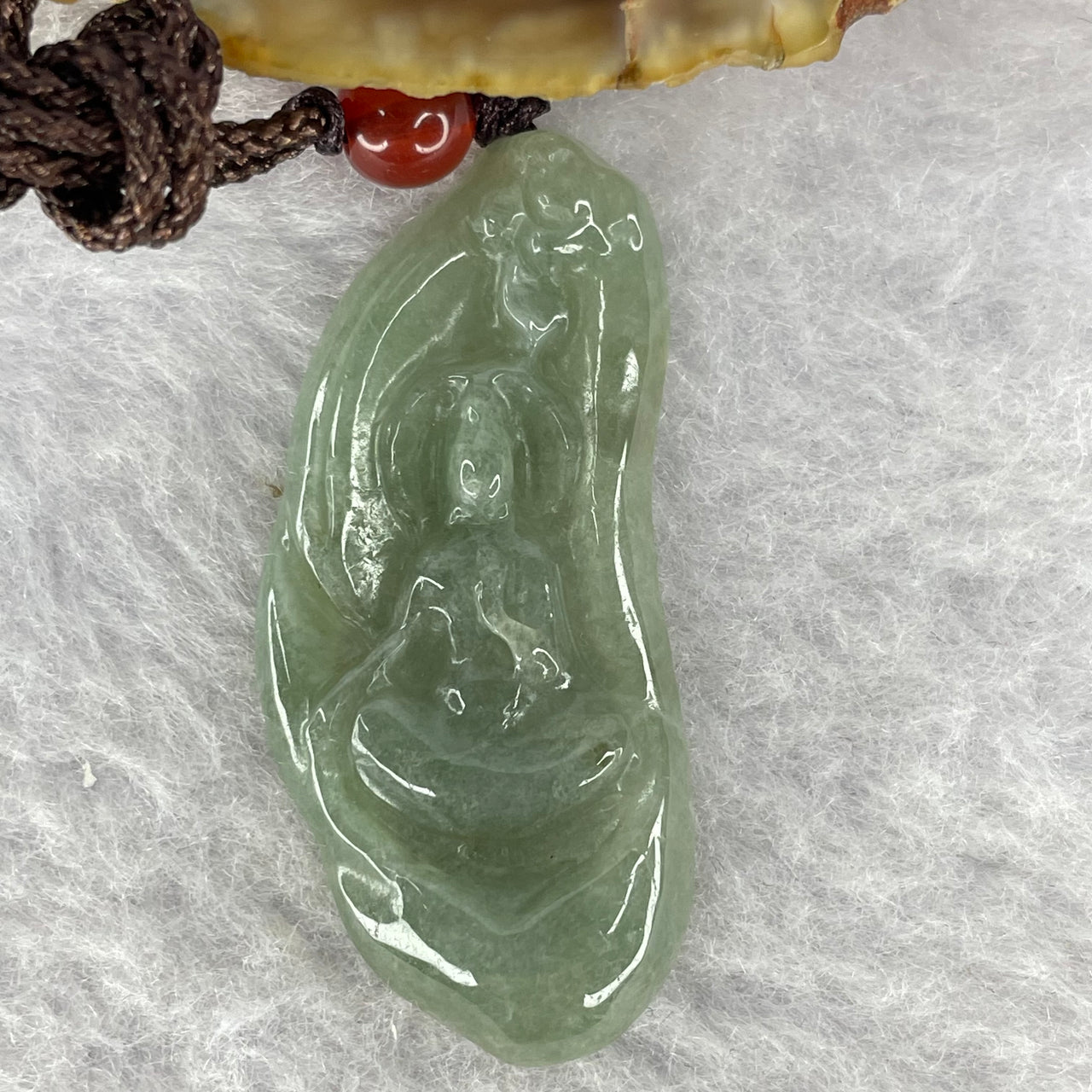 Type A Blueish Green Jadeite Guan Yin 5.90g 40.9 by 18.2 by 4.0 mm - Huangs Jadeite and Jewelry Pte Ltd