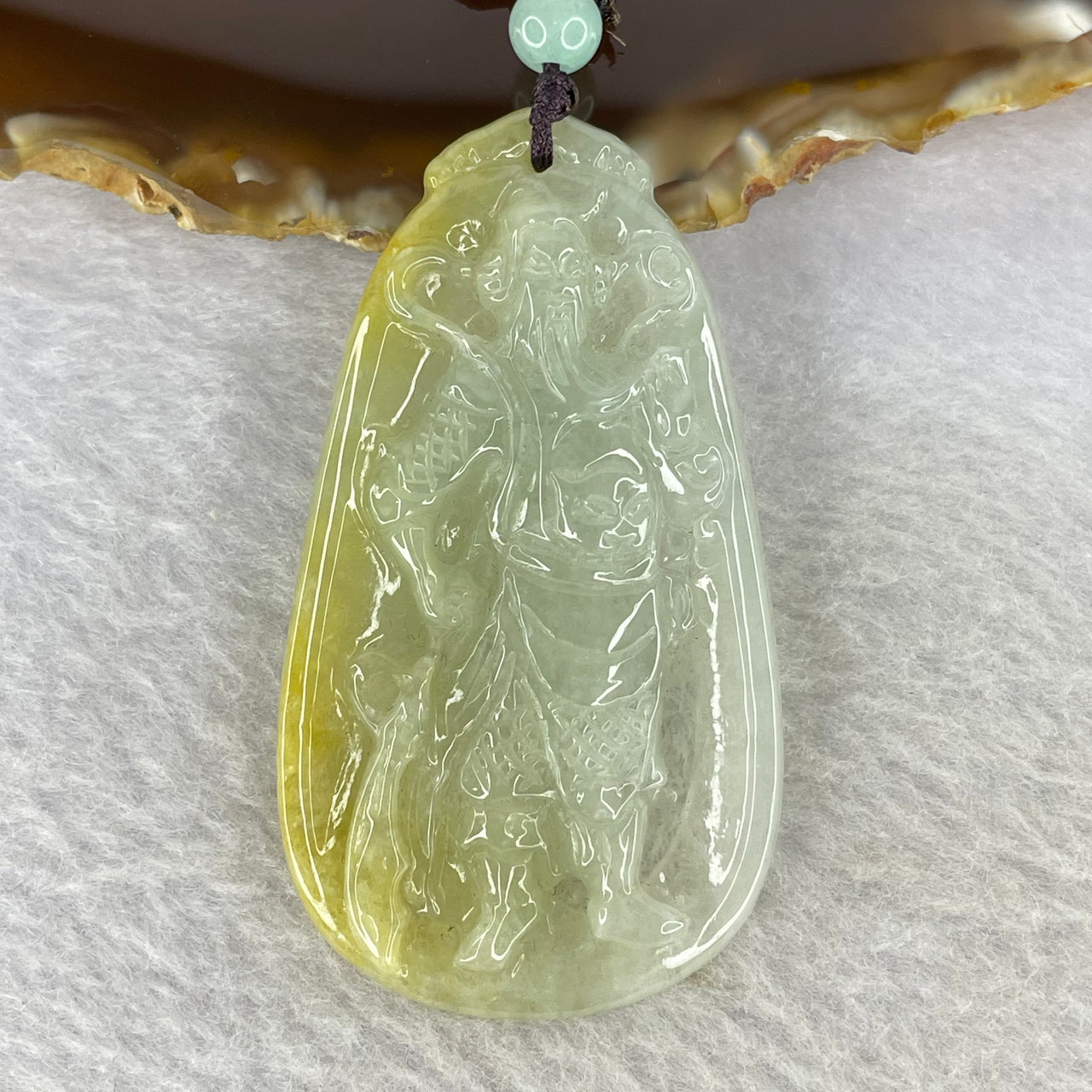 Type A Semi Icy Yellow Green and Light Lavender Jadeite Guan Gong Pendent 22.23g 61.8 by 34.3 by 7.0 mm - Huangs Jadeite and Jewelry Pte Ltd