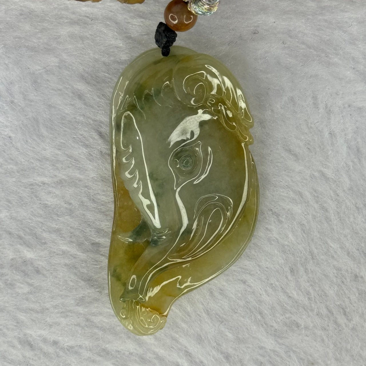 Type A Brownish Yellow with Green Jadeite Elephant With Leaf Pendent 13.37g 41.3 by 21.6 by 9.0mm