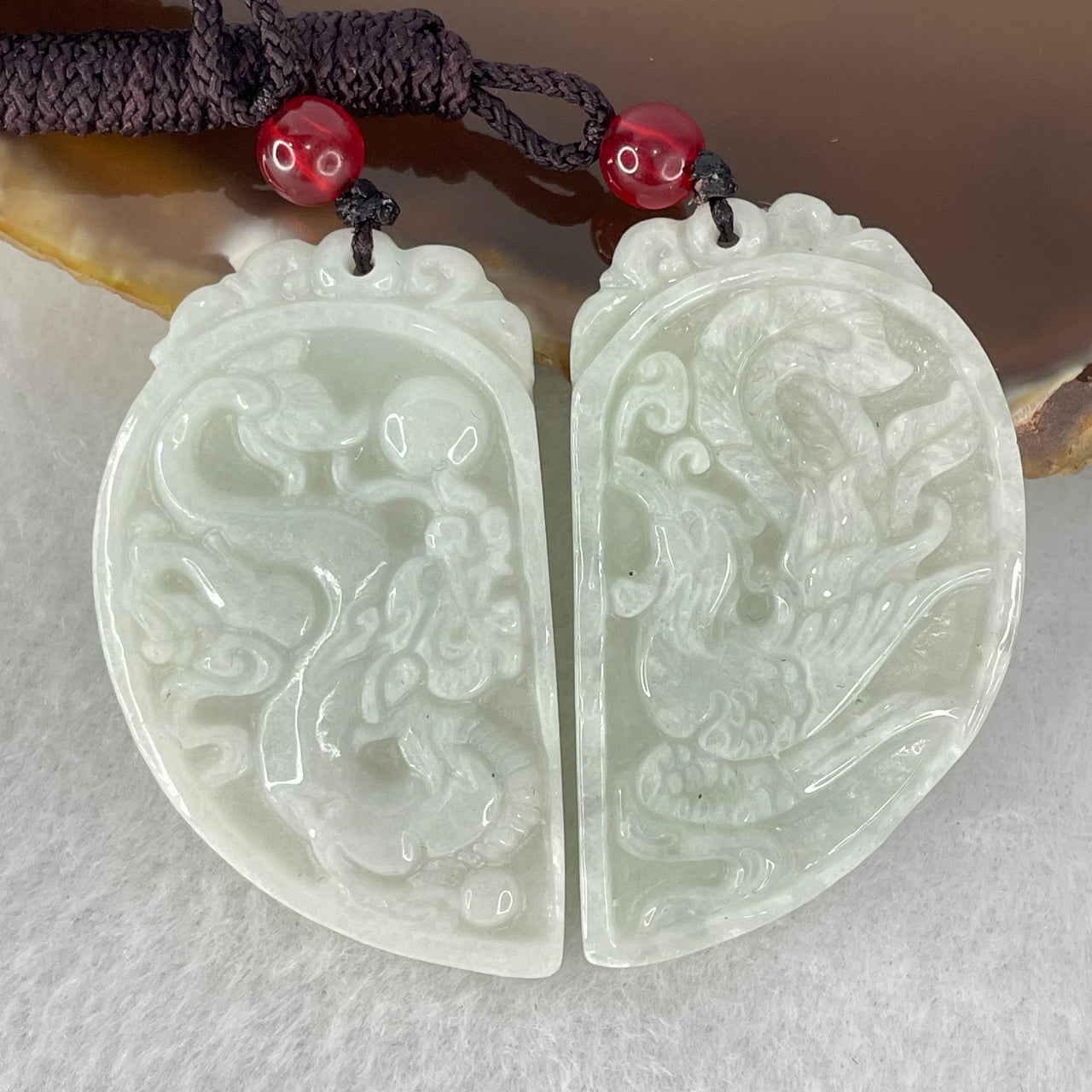 Type A Faint Green Lavender Jadeite Dragon and Phoenix Cut in Half Pendant Pair 24.12g 43.6 by 25.7 by 4.6mm