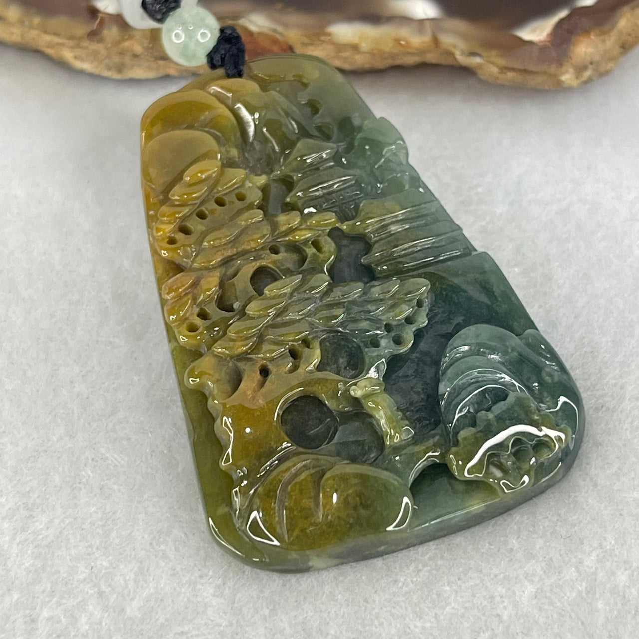 Type A Semi Icy Blueish Green with Yellowish Brown Patches Jadeite Double Sided Shan Shui with Gui Ren Benefactor Pendant 27.29g 53.7 by 37.3 by 7.5mm