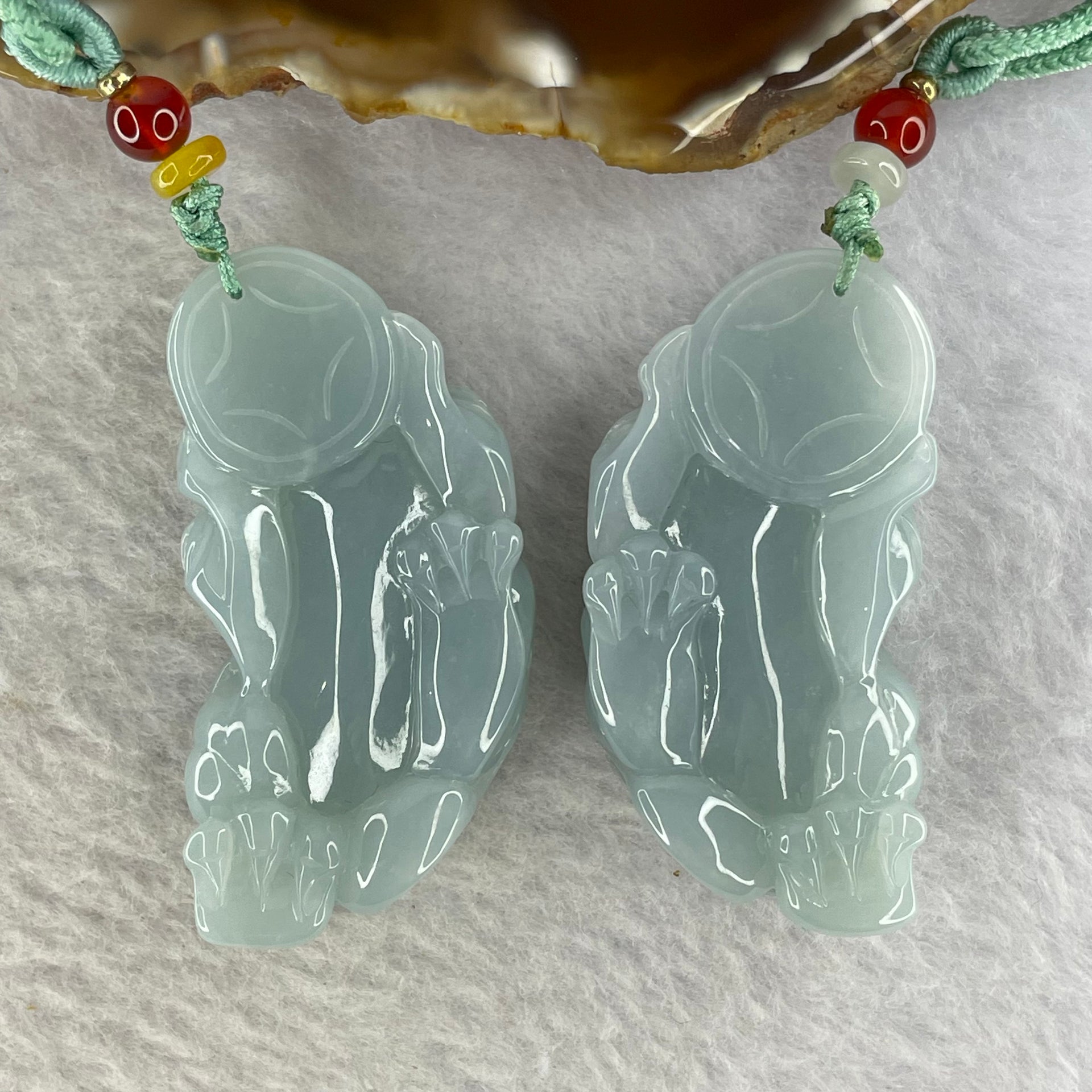 Type A Sky Blue Jadeite Pixiu Pair  40.26g 50.7 by 26.4 by 14.3 mm and 38.99g 49.7 by 25.3 by 14.2 mm - Huangs Jadeite and Jewelry Pte Ltd