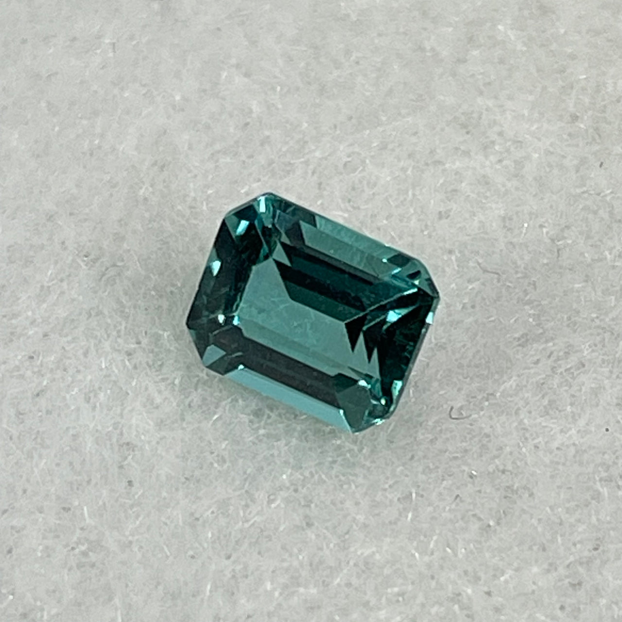 Rare Natural Greenish Blue Tourmaline Stone For Setting Cut -cornered rectangular, step cut 0.90cts 6.31 by 5.18 by 3.59mm NGI Cert No:32887345