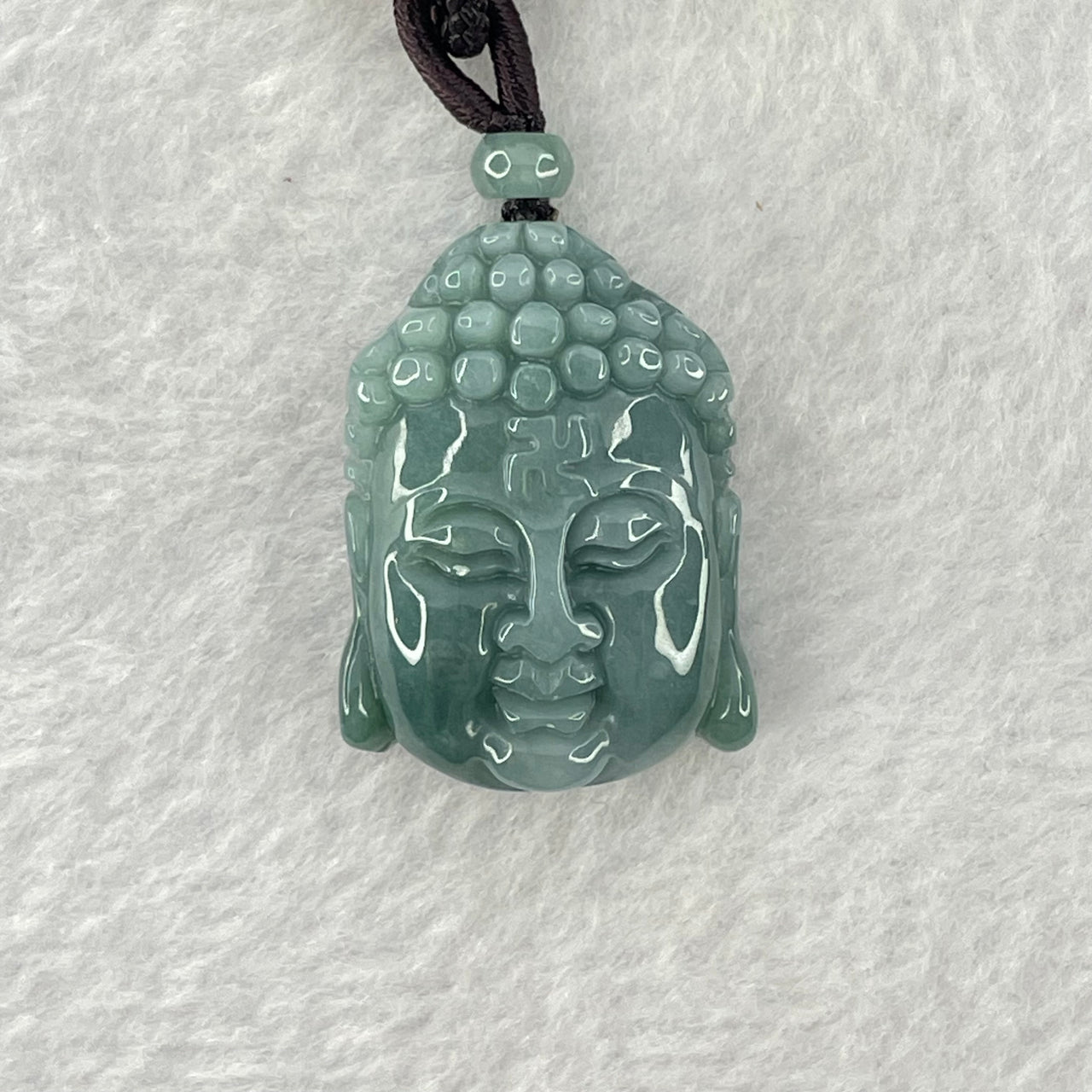 Type A Blueish Green Jadeite Buddha Head Pendant 20.25g 29.9 by 21.9 by 13.1mm