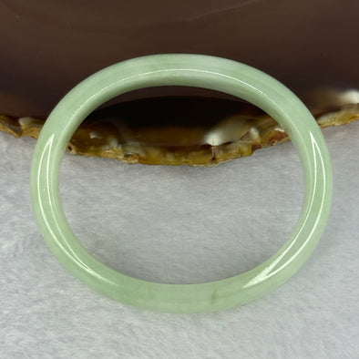 Type A Light Apple Green Jadeite Oval Bangle 33.35g Internal Diameter 52.3mm 12.2 by 6.5mm (Very Slight Fine Internal Lines)