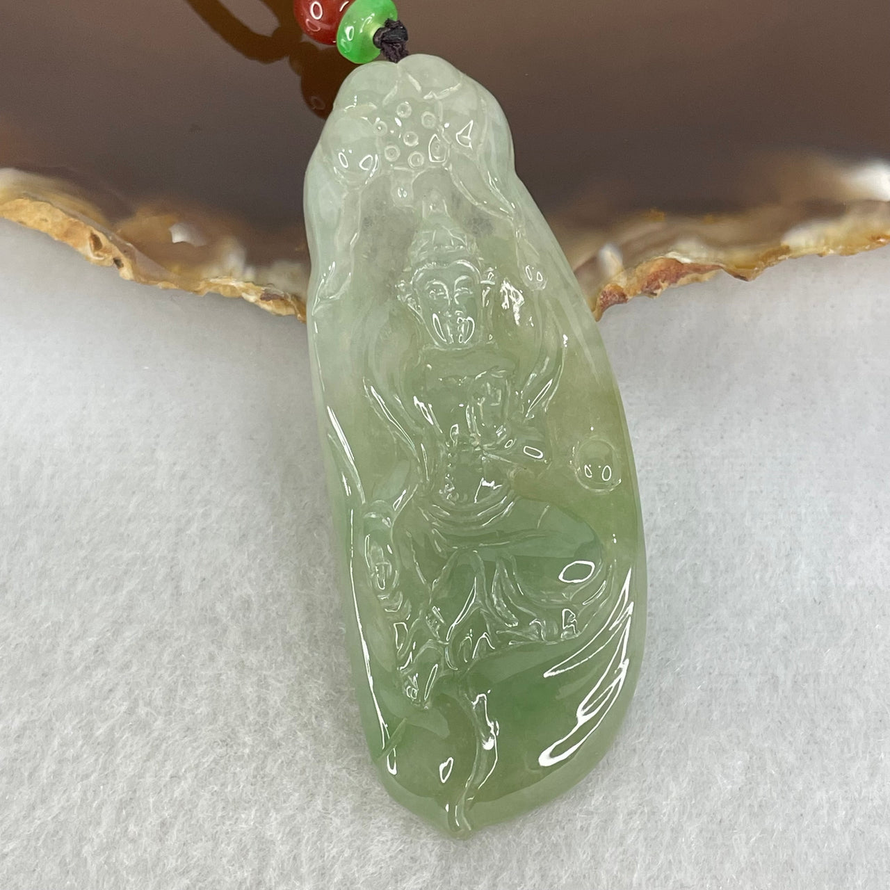 Type A Semi Icy Light Blueish Green Jadeite Guan Yin Pendant 20.29g 62.4 by 25.2 by 6.3mm