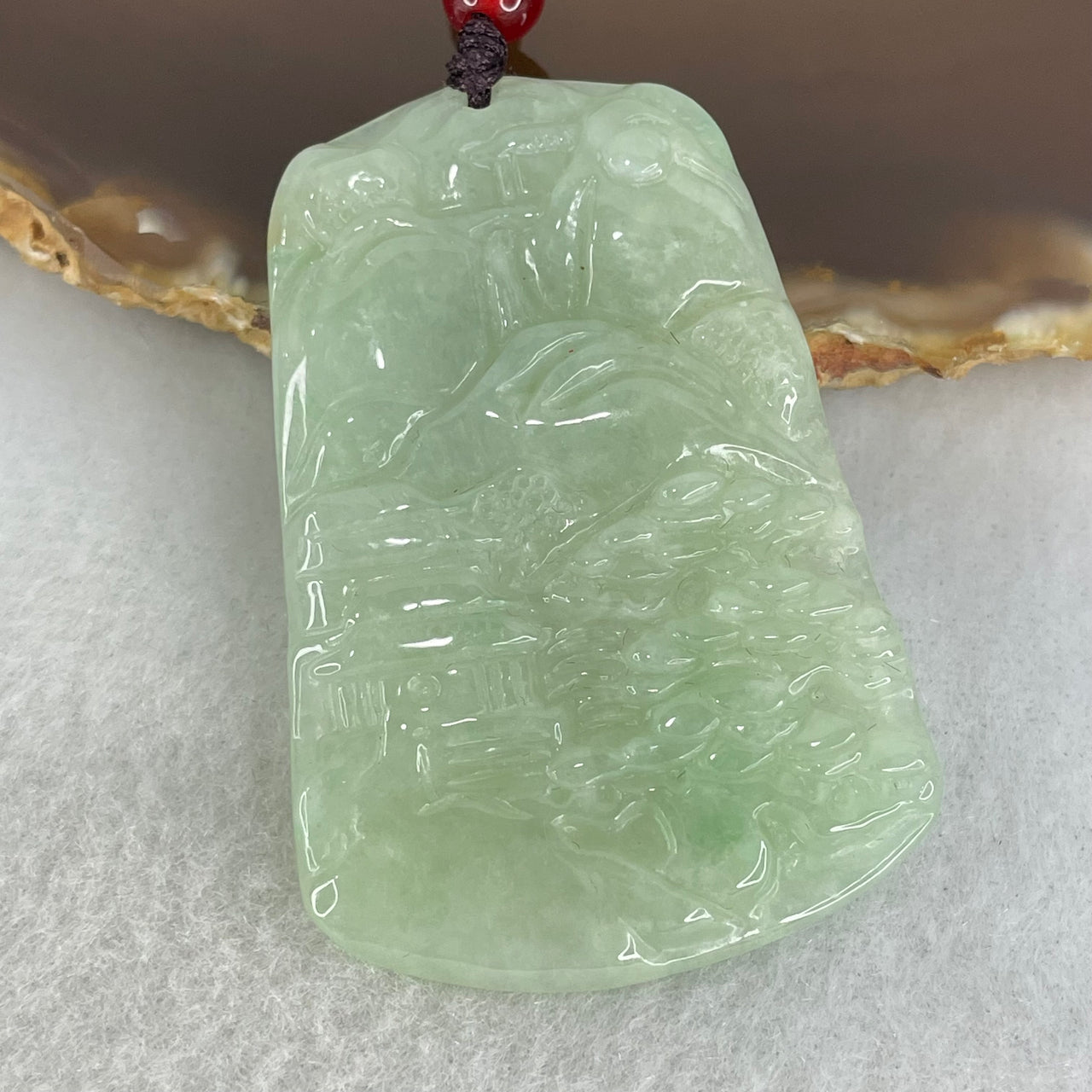 Type A Semi Icy Light Green Jadeite Shan Shui with Gui Ren Benefactor Pendant 19.35g 51.4 by 35.3 by 5.4mm