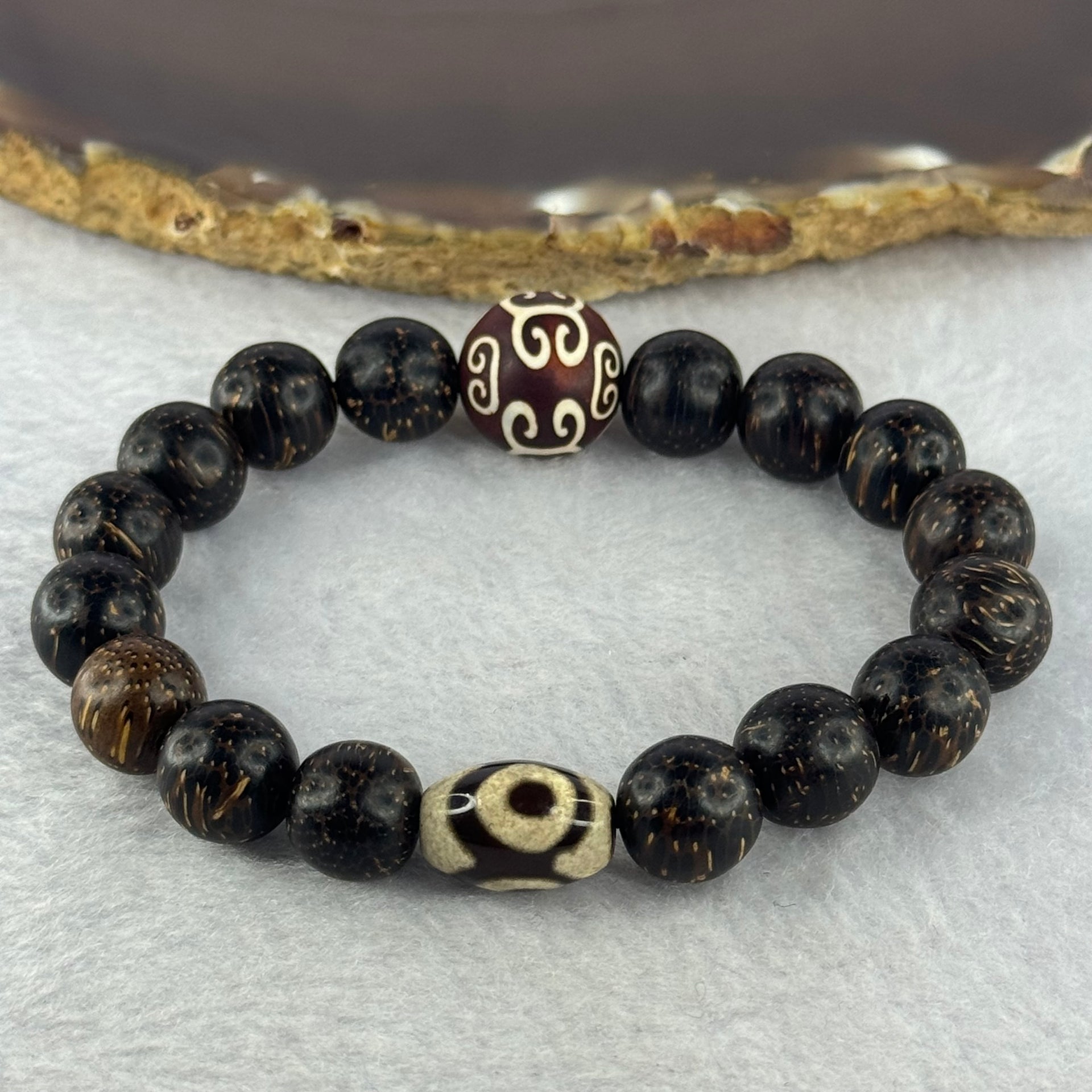 Natural Agarwood With 3 Eyes Dzi Bead Tian Zhu Beads Bracelet 天然沉香带三眼天珠手链 17.56g 16.5cm Dzi 14.4 by 9.8 and 14.1mm 1 Bead and 10.8mm 16 Beads - Huangs Jadeite and Jewelry Pte Ltd