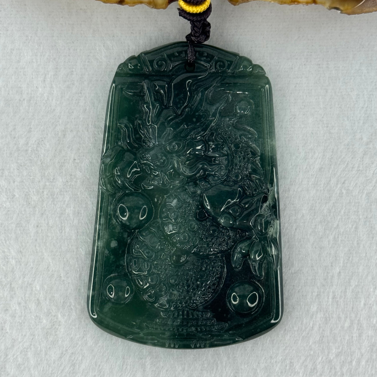 Type A Semi Icy Dark Blueish Green Jadeite Dragon Pendant 20.47g 58.7 by 37.8 by 5.3mm