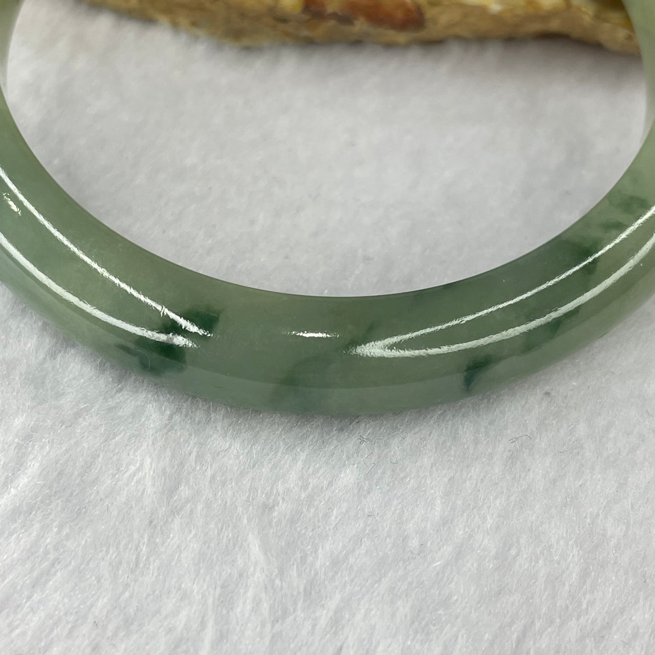 Type A Green Piao Hua Jadeite Bangle 55.46g inner Diameter 62.8mm 10.6 by 8.6mm (External Rough) - Huangs Jadeite and Jewelry Pte Ltd