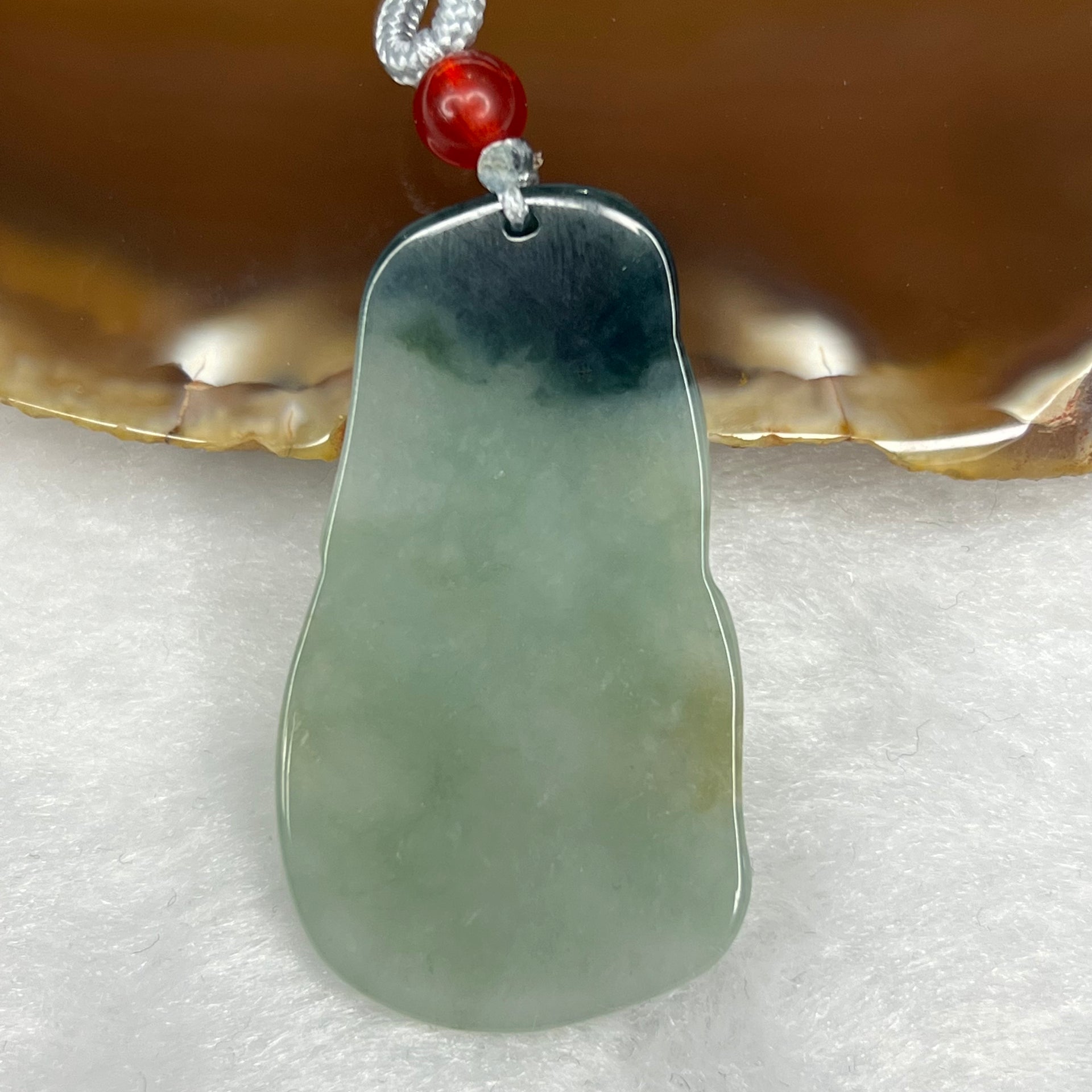 Type A Semi Icy Green Piao Hua Guan Yin Pendant 11.91g 44.3 by 25.0 by 4.1 mm - Huangs Jadeite and Jewelry Pte Ltd