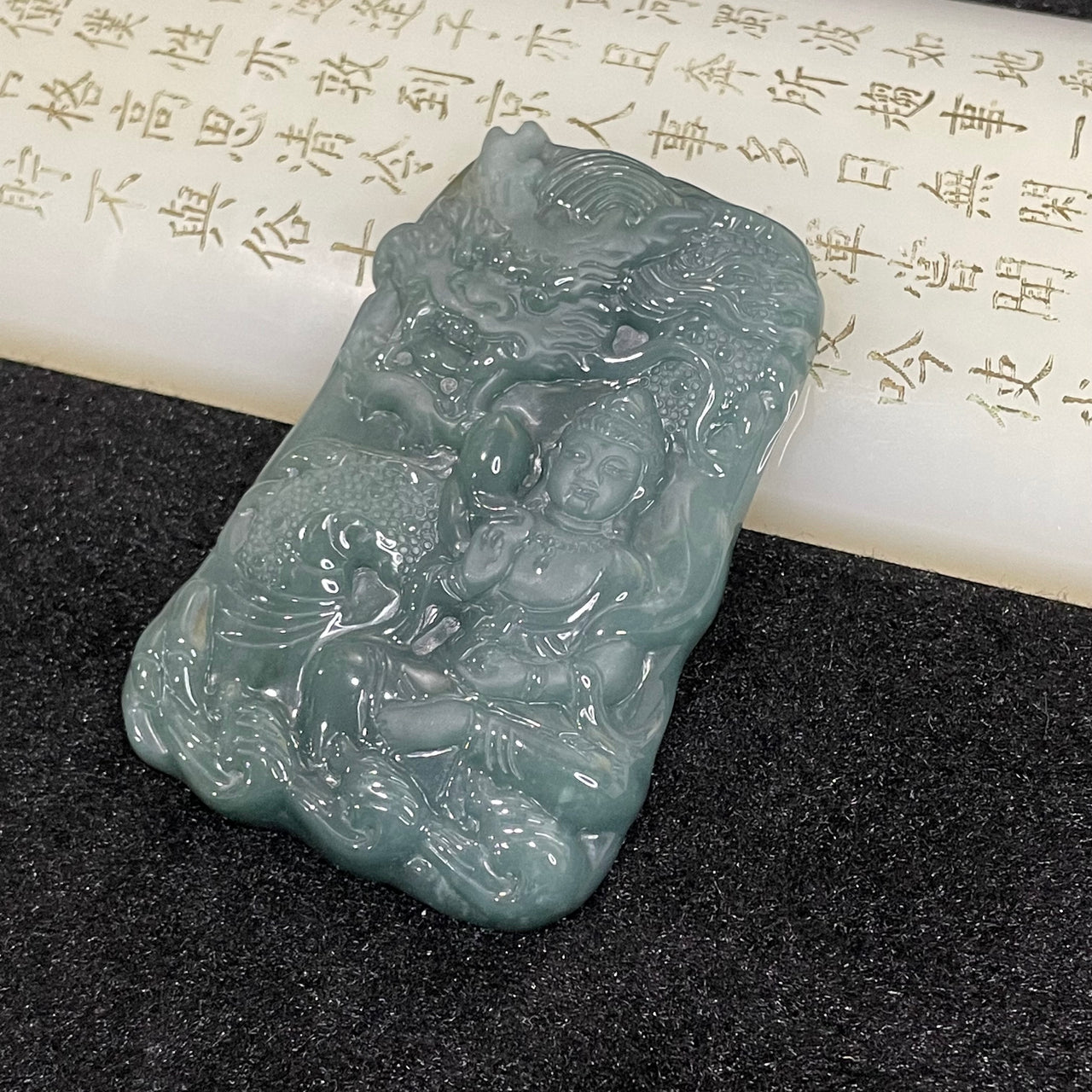 Type A Blueish Green Guan Yin & Dragon Jade Jadeite 56.14g 66.6 by 44.3 by 9.3mm - Huangs Jadeite and Jewelry Pte Ltd