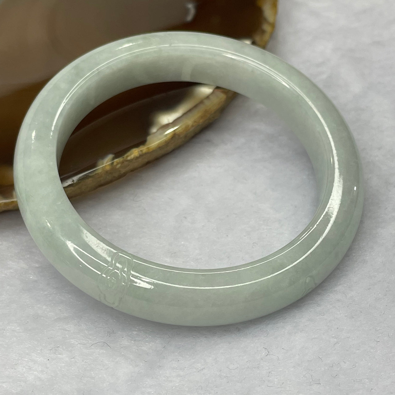 Type A Light Green Jadeite Bangle With Ruyi 51.82g inner diameter 54.0mm 10.7 by 8.5mm - Huangs Jadeite and Jewelry Pte Ltd