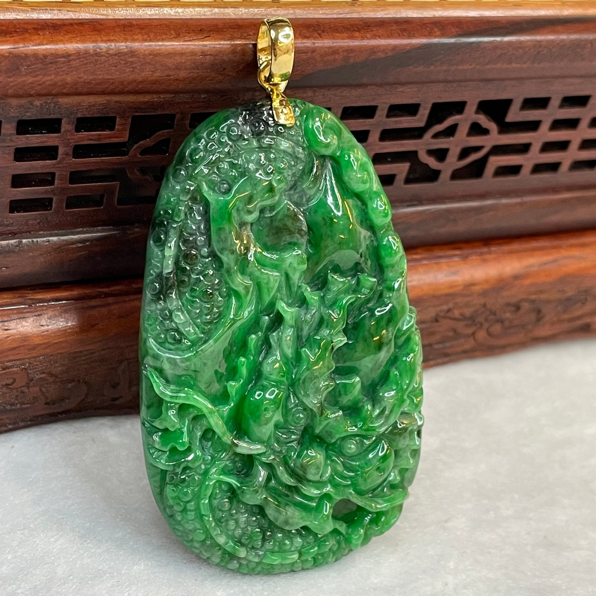 18 Yellow Gold Rare Type A Green with Dark Green Patches Jade Jadeite Prosperity Dragon Feng Shui Pendant with NGI Cert 142.63 cts 57.91 by 36.09 by 7.43mm - Huangs Jadeite and Jewelry Pte Ltd