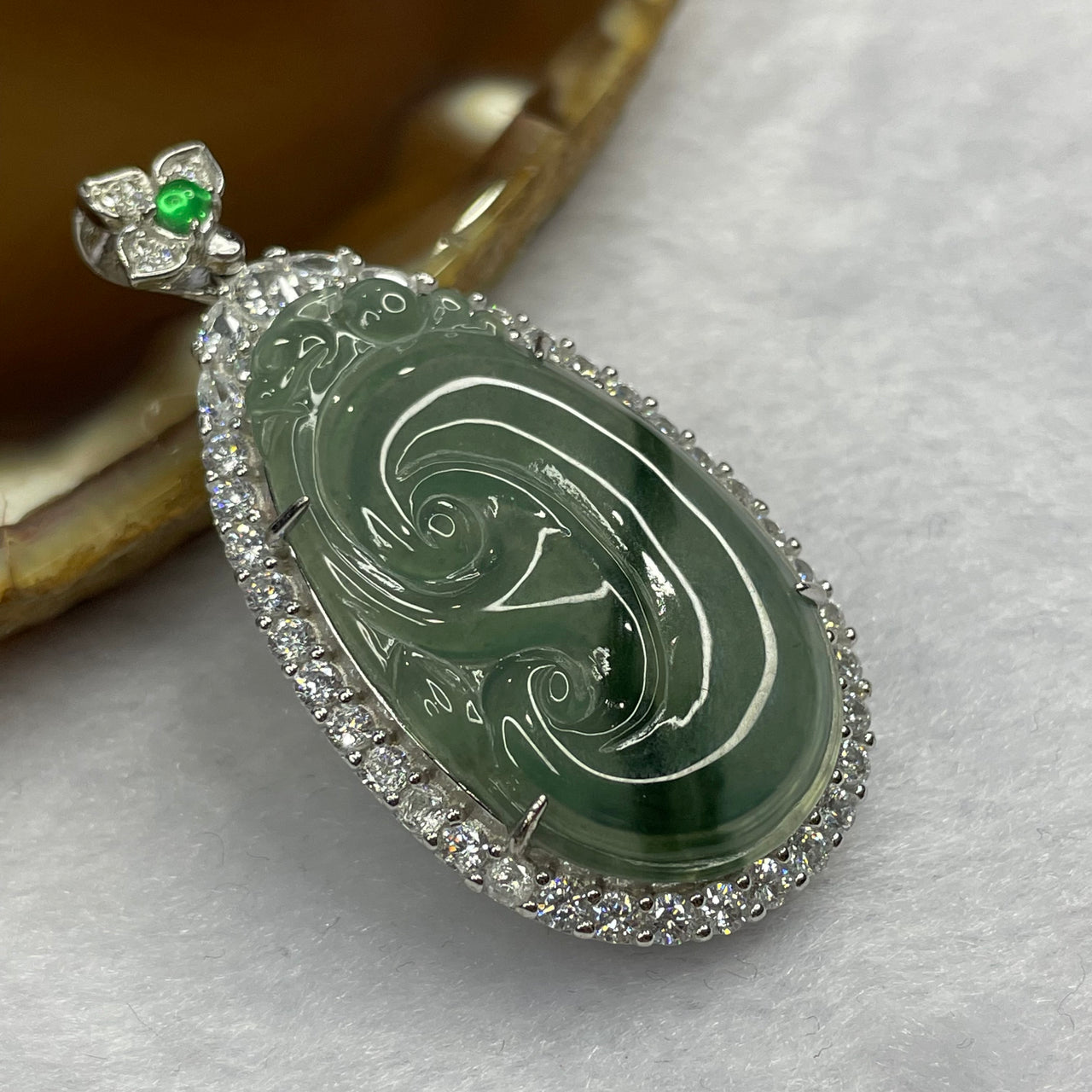 Type A Semi Icy Green Piao Hua Jade Jadeite Ruyi Pendant with 925 Silver Setting 9.80g 46.7 by 23.5 by 9.2 mm - Huangs Jadeite and Jewelry Pte Ltd