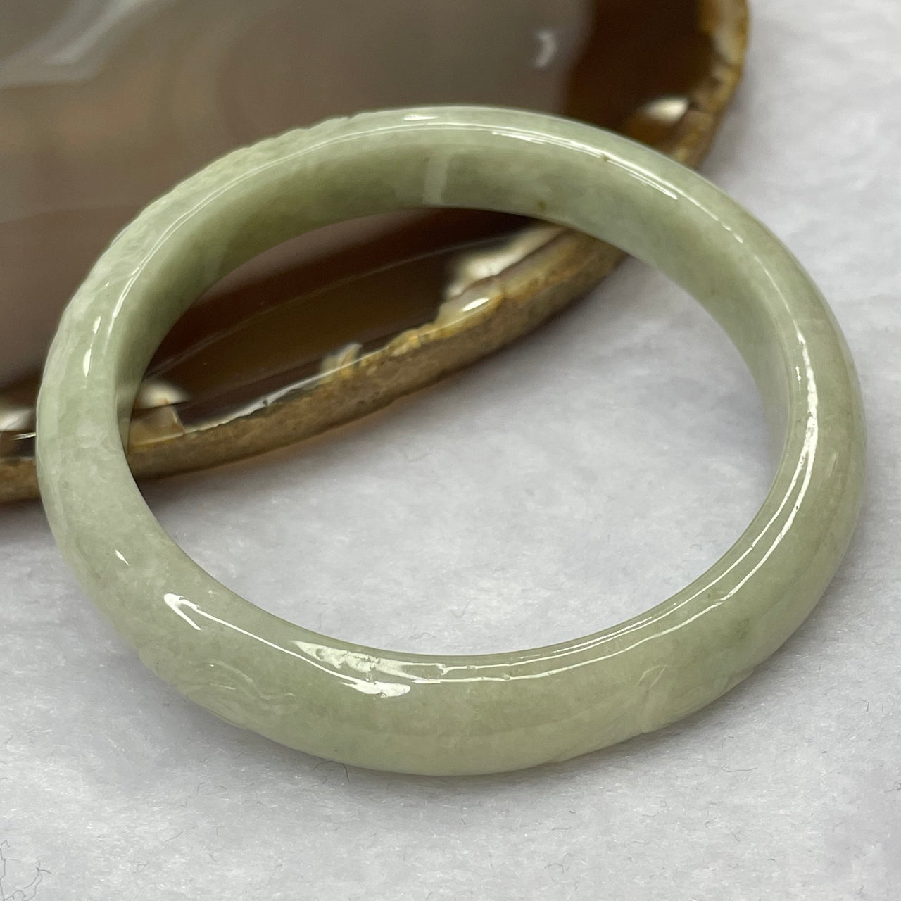 Type A Green Jadeite Bangle with Flower Carvings 37.28g inner diameter 55.2mm 10.1 by 6.7mm - Huangs Jadeite and Jewelry Pte Ltd