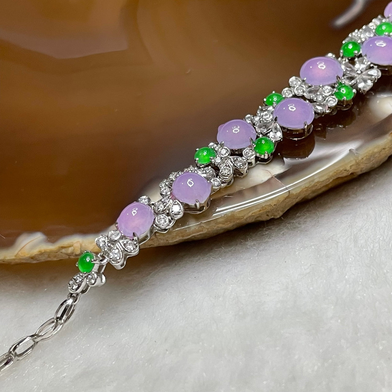 RARE Type A Semi Icy Lavender & Green Jade Jadeite Bracelet 18k white gold, natural diamonds & sapphires 7.23g Dimensions of middle piece: 88.2 by 9.2 by 4.7mm Length of Bracelet: 16cm - Huangs Jadeite and Jewelry Pte Ltd