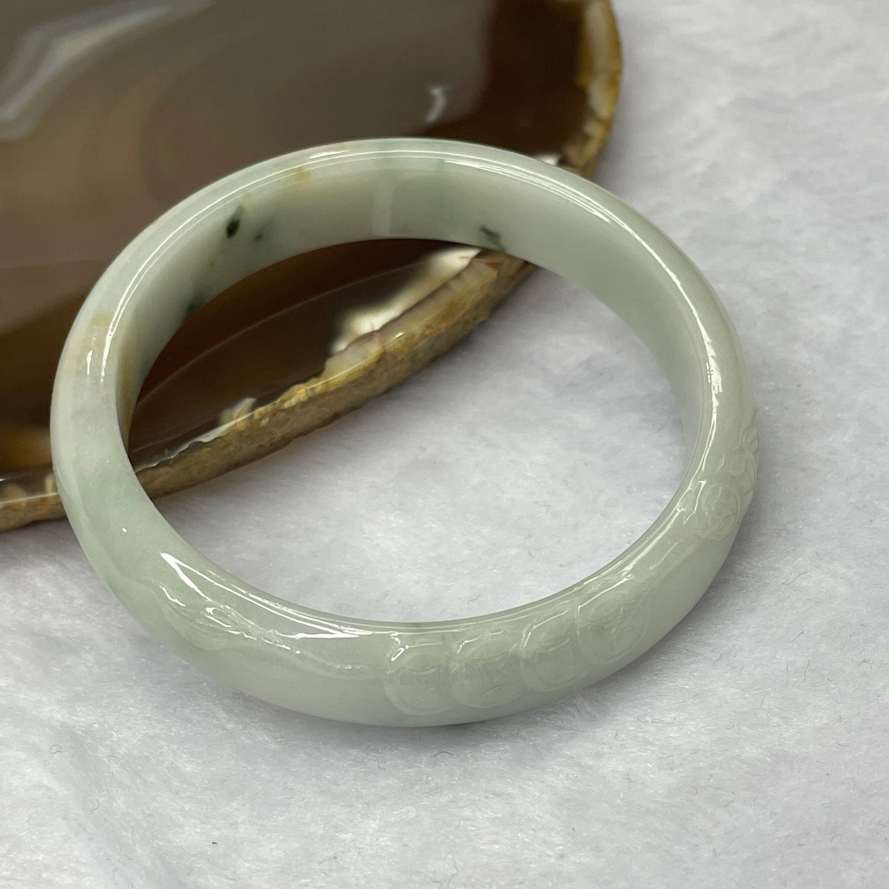 Type A Green Piao Hua Jadeite Bangle with Gold Coin Carving 41.37g inner diameter 55.1mm 12.2 by 6.6mm - Huangs Jadeite and Jewelry Pte Ltd