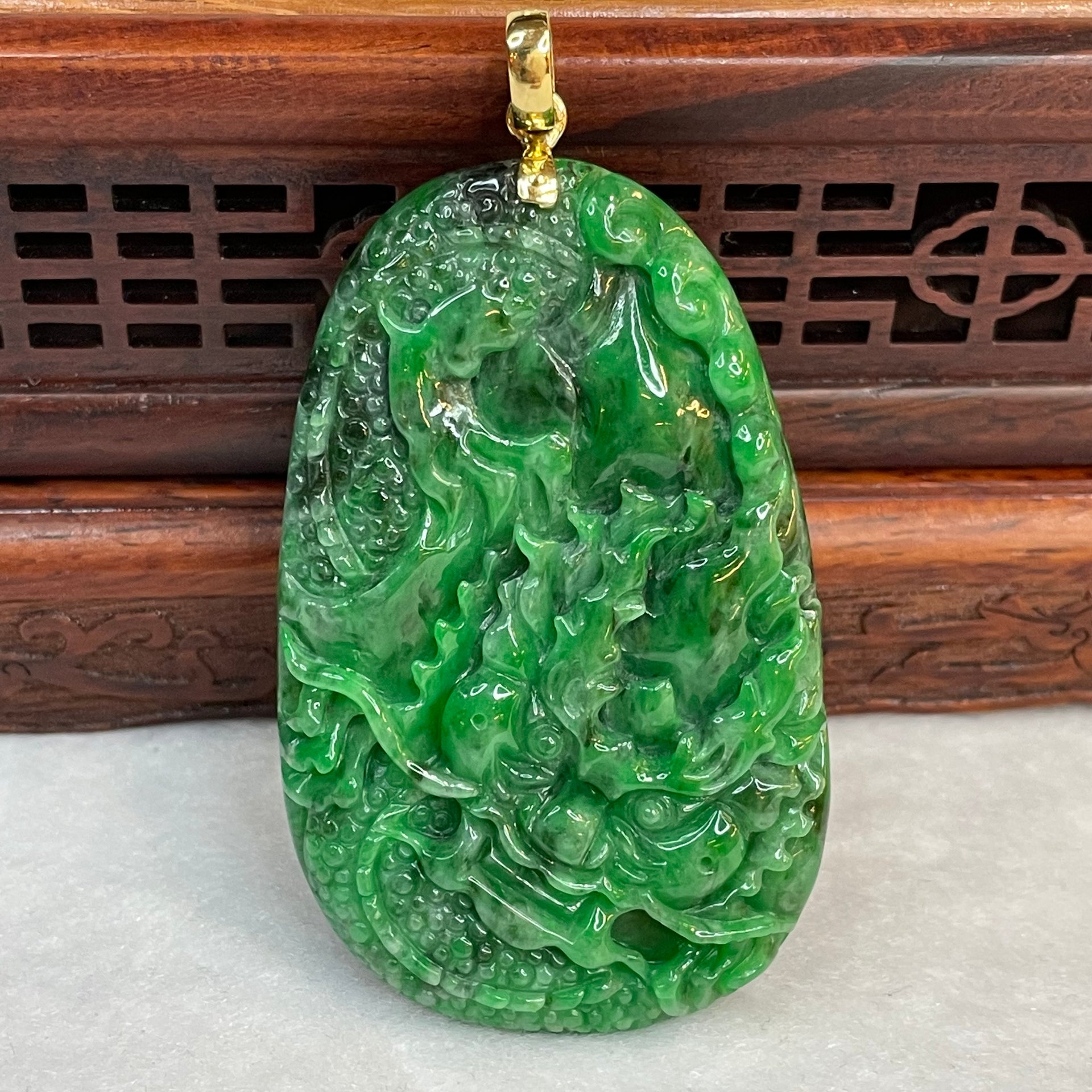 18 Yellow Gold Rare Type A Green with Dark Green Patches Jade Jadeite Prosperity Dragon Feng Shui Pendant with NGI Cert 142.63 cts 57.91 by 36.09 by 7.43mm - Huangs Jadeite and Jewelry Pte Ltd