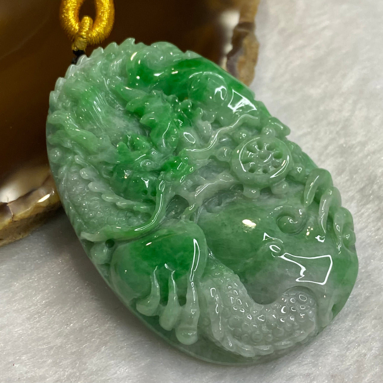 Type A Emerald Green Jadeite Dragon 58.33g 61.4 by 39.8 by 10.6mm - Huangs Jadeite and Jewelry Pte Ltd