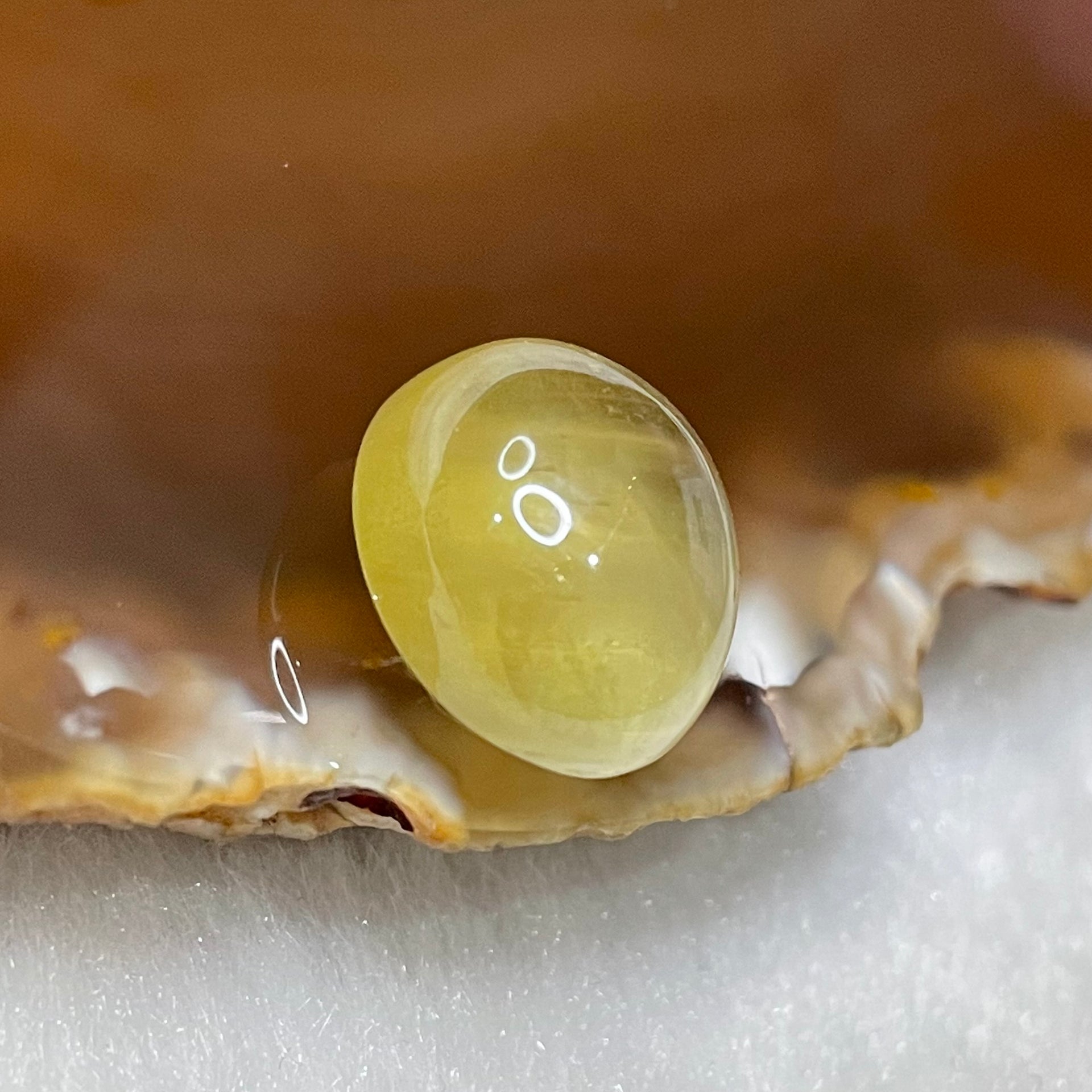 Natural Apatite Cat’s Eye with NGI cert 15.67 carats 15.28 by 13.41 by 8.93mm - Huangs Jadeite and Jewelry Pte Ltd