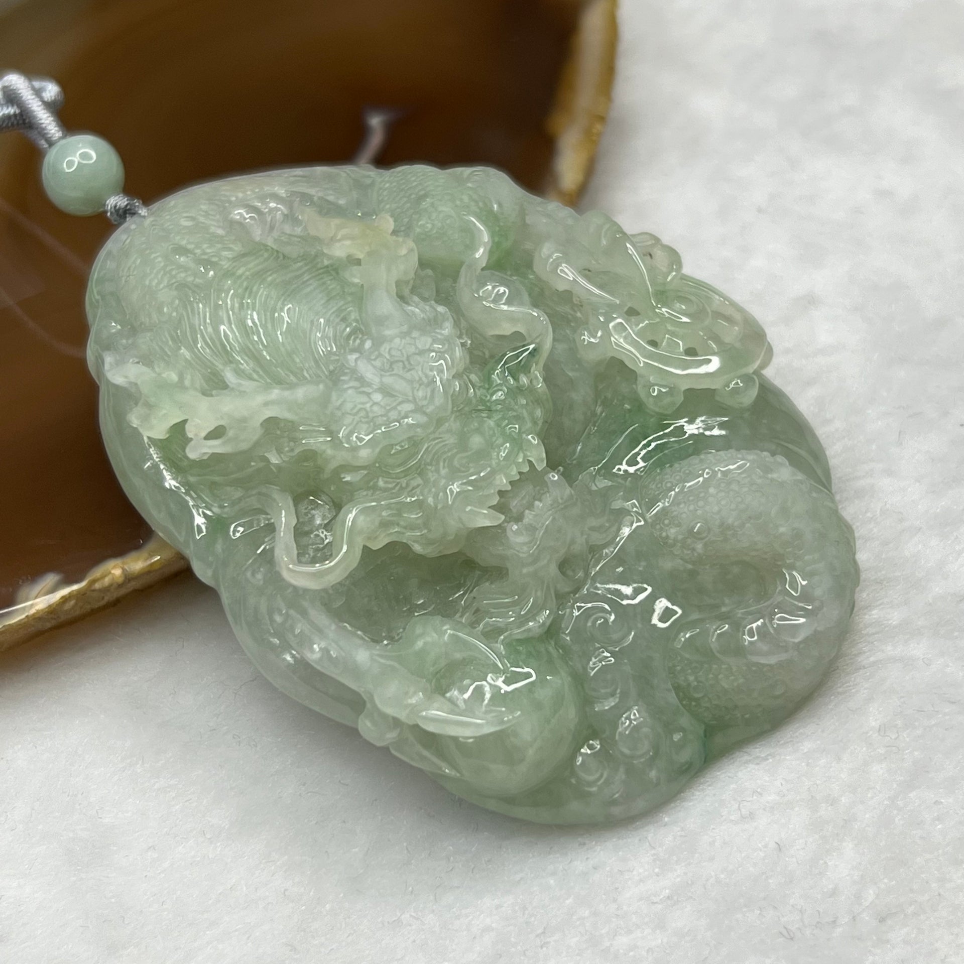 Type A Semi Icy Green Jadeite Dragon Pendant 102.64g 71.2 by 52.0 by 19.3mm - Huangs Jadeite and Jewelry Pte Ltd