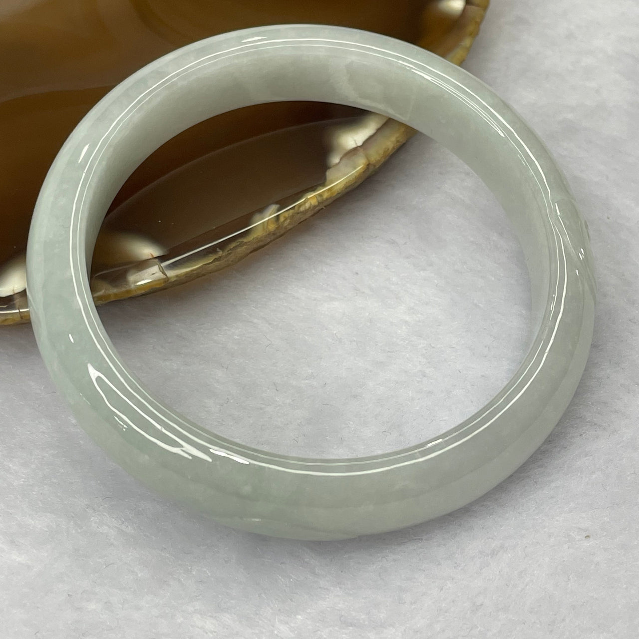 Type A Light Green Jadeite Bangle with Ruyi 48.18g inner diameter 56.2mm 12.5 by 7.3mm - Huangs Jadeite and Jewelry Pte Ltd