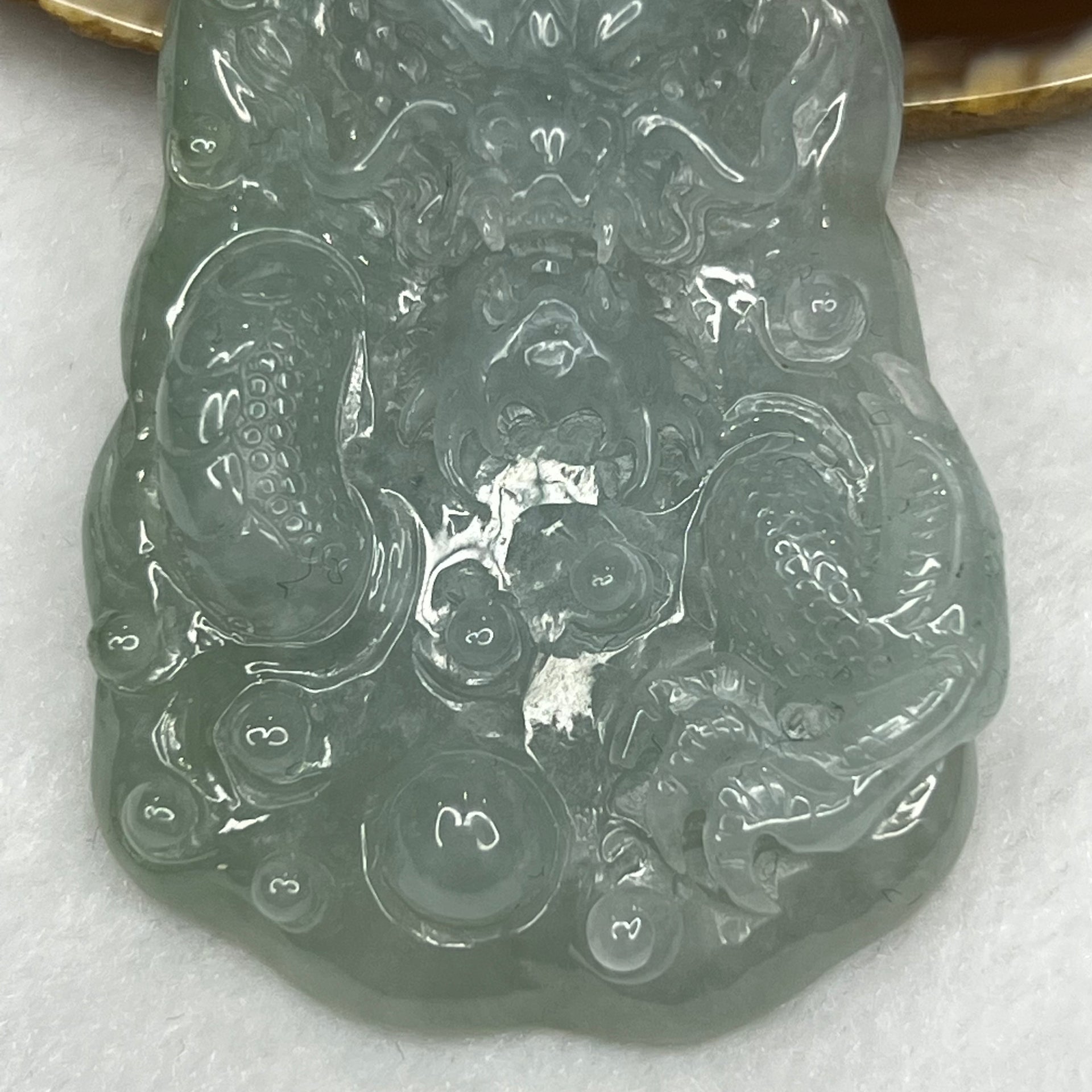 Type A Icy Green Jadeite Dragon Pendant 56.88g 74.0 by 42.4 by 9.6 mm - Huangs Jadeite and Jewelry Pte Ltd