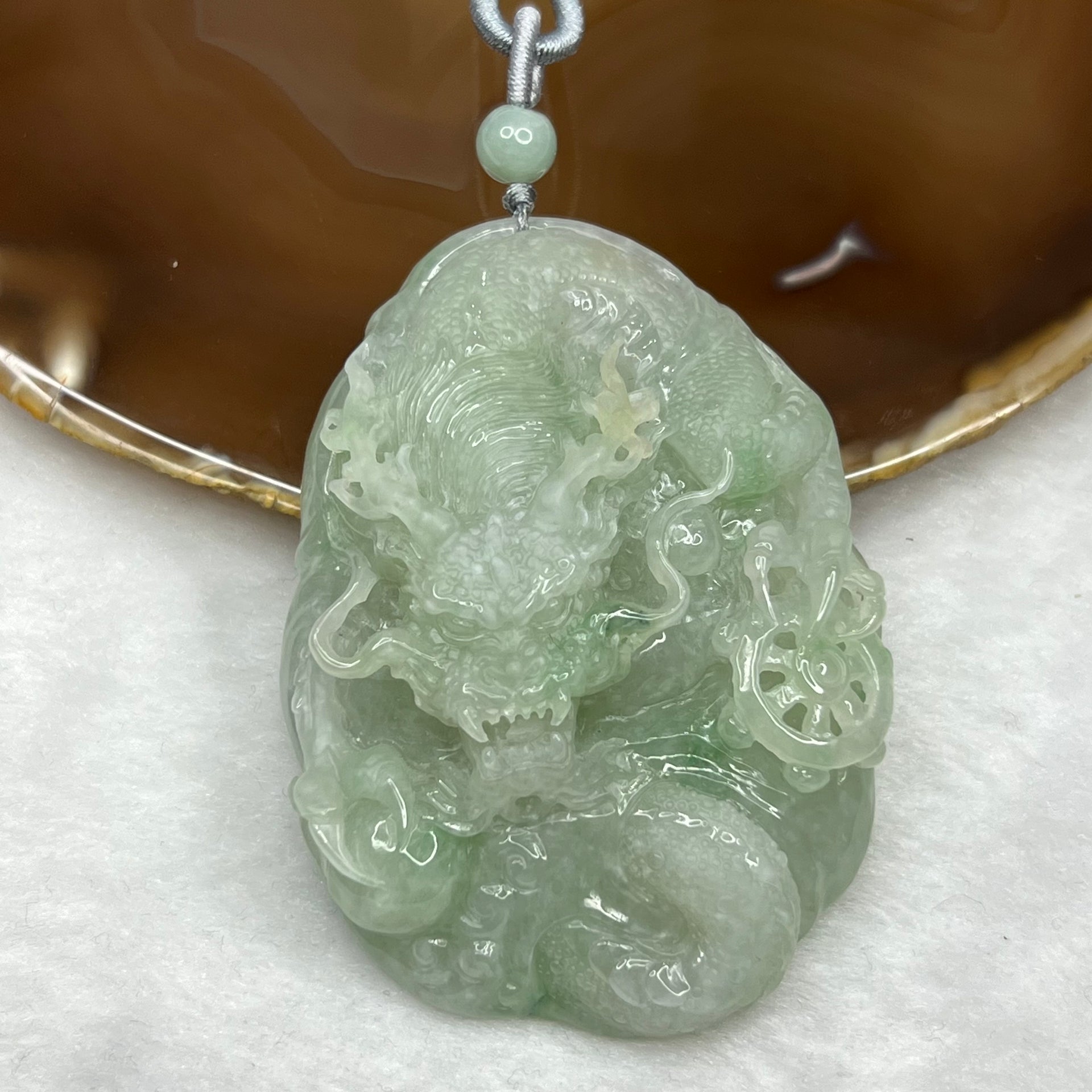 Type A Semi Icy Green Jadeite Dragon Pendant 102.64g 71.2 by 52.0 by 19.3mm - Huangs Jadeite and Jewelry Pte Ltd