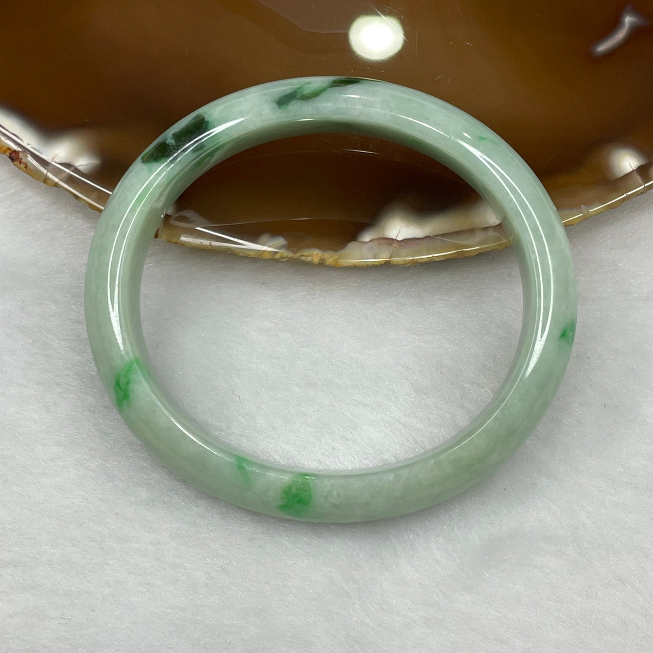 Type A Green Piao Hua Jadeite Oval Bangle 36.84g inner diameter 52.4mm 11.8 by 6.8mm - Huangs Jadeite and Jewelry Pte Ltd