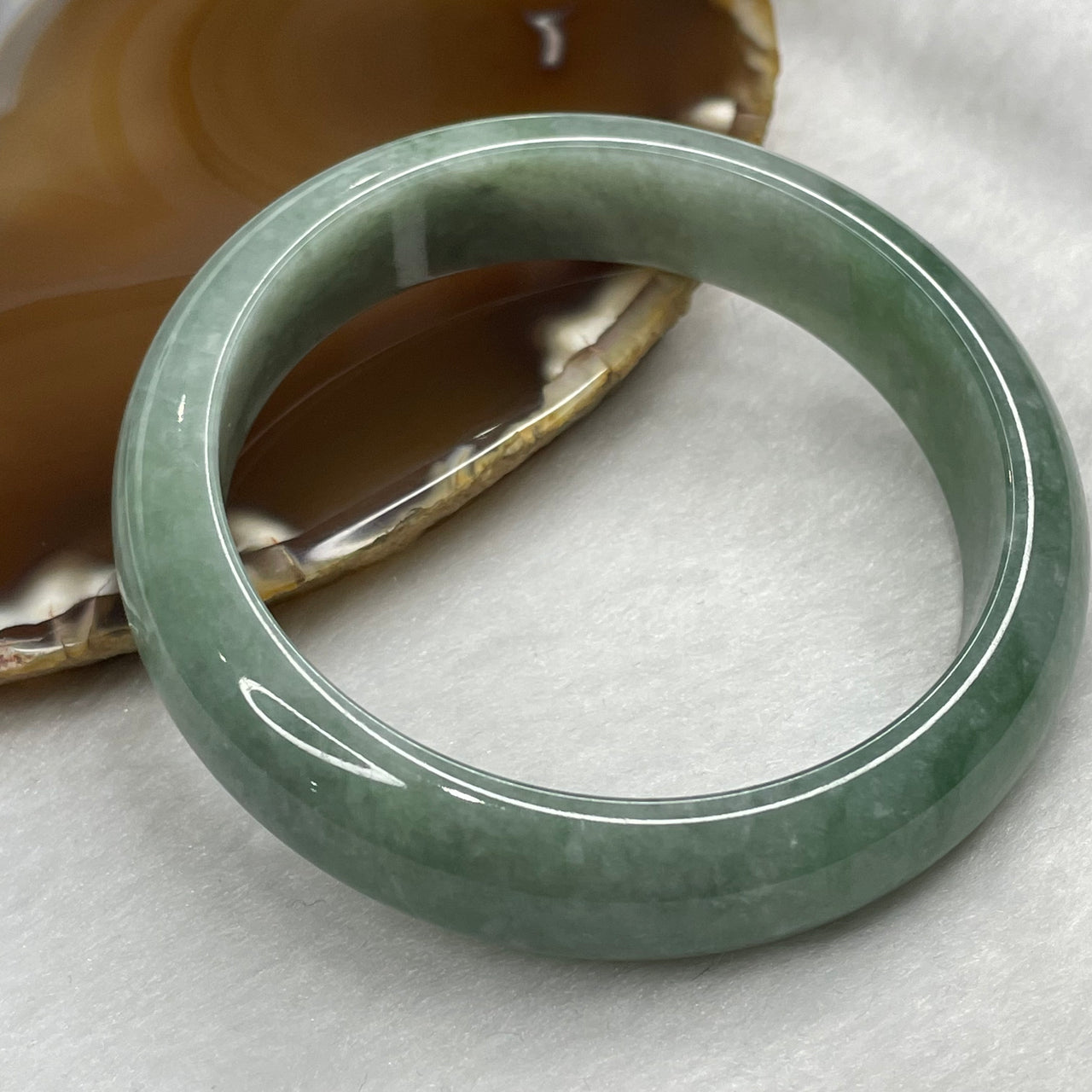 Type A Green Jadeite Bangle 63.09g inner diameter 58.6mm 14.1 by 8.0mm - Huangs Jadeite and Jewelry Pte Ltd